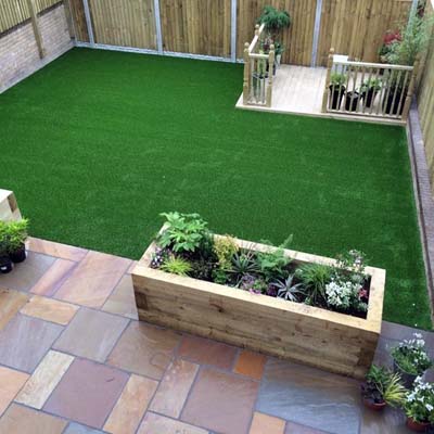 A garden in Castleford, where we built a raised flowerbed, and laid decorative paving and a lawn.
