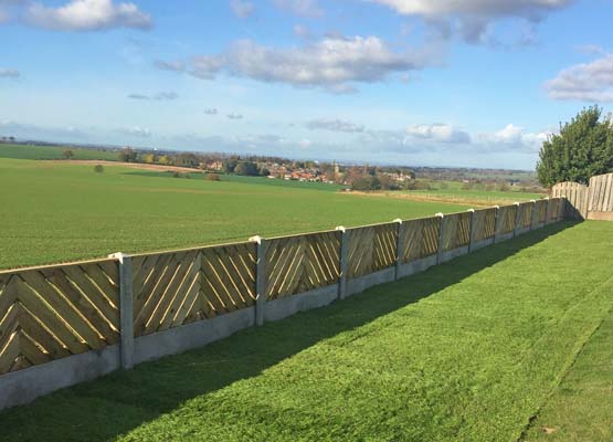 A fence we erected separating a large garden from the farmer's field.